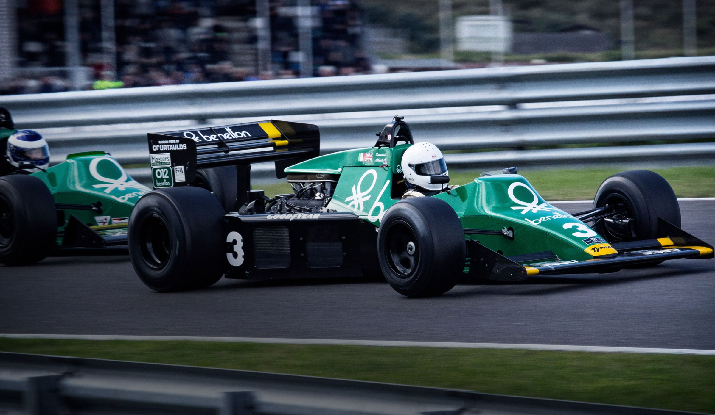 Formula 1 car in Heineken green on the race track